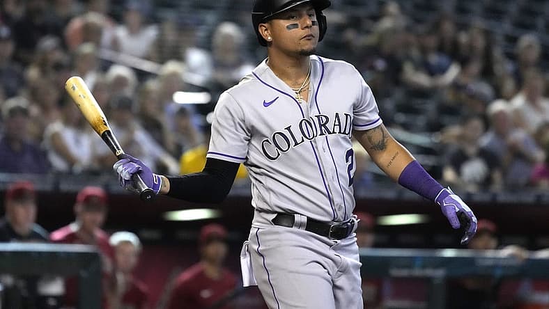 Aug 7, 2022; Phoenix, Arizona, USA; Colorado Rockies center fielder Yonathan Daza (2) reacts after walking against the Arizona Diamondbacks in the ninth inning at Chase Field. Mandatory Credit: Rick Scuteri-USA TODAY Sports