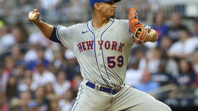 Aug 15, 2022; Atlanta, Georgia, USA; New York Mets starting pitcher Carlos Carrasco (59) throws against the Atlanta Braves in the first inning at Truist Park. Mandatory Credit: Brett Davis-USA TODAY Sports