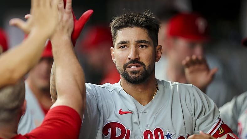 Aug 16, 2022; Cincinnati, Ohio, USA; Philadelphia Phillies right fielder Nick Castellanos (8) high fives teammates after hitting a solo home run in the third inning against the Cincinnati Reds at Great American Ball Park. Mandatory Credit: Katie Stratman-USA TODAY Sports