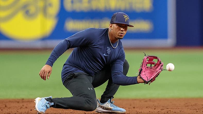 Aug 23, 2022; St. Petersburg, Florida, USA;  Tampa Bay Rays shortstop Wander Franco (5) takes ground balls before a game against the Los Angeles Angels at Tropicana Field. Mandatory Credit: Nathan Ray Seebeck-USA TODAY Sports
