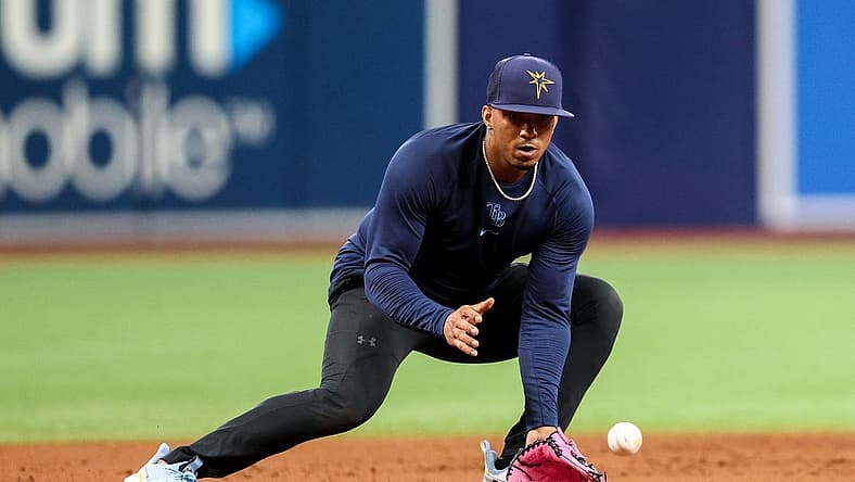 Aug 23, 2022; St. Petersburg, Florida, USA; Tampa Bay Rays shortstop Wander Franco (5) takes ground balls before a game against the Los Angeles Angels at Tropicana Field. Mandatory Credit: Nathan Ray Seebeck-USA TODAY Sports