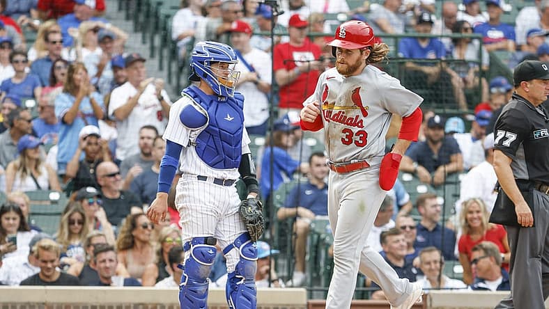 Aug 25, 2022; Chicago, Illinois, USA; St. Louis Cardinals left fielder Brendan Donovan (33) scores a run against the Chicago Cubs during the eight inning at Wrigley Field. Mandatory Credit: Kamil Krzaczynski-USA TODAY Sports