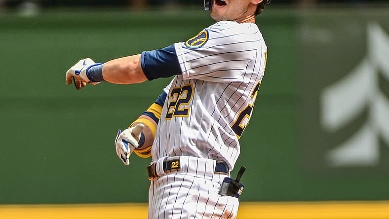Aug 28, 2022; Milwaukee, Wisconsin, USA; Milwaukee Brewers left fielder Christian Yelich (22) reacts after he was thrown out trying to stretch a single into a double in the first inning against the Chicago Cubs at American Family Field. Mandatory Credit: Benny Sieu-USA TODAY Sports