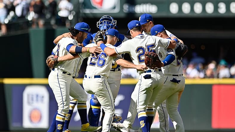 Aug 28, 2022; Seattle, Washington, USA; The Seattle Mariners infielders celebrate defeating the Cleveland Guardians at T-Mobile Park. Seattle defeated against the Cleveland Guardians 4-0. Mandatory Credit: Steven Bisig-USA TODAY Sports