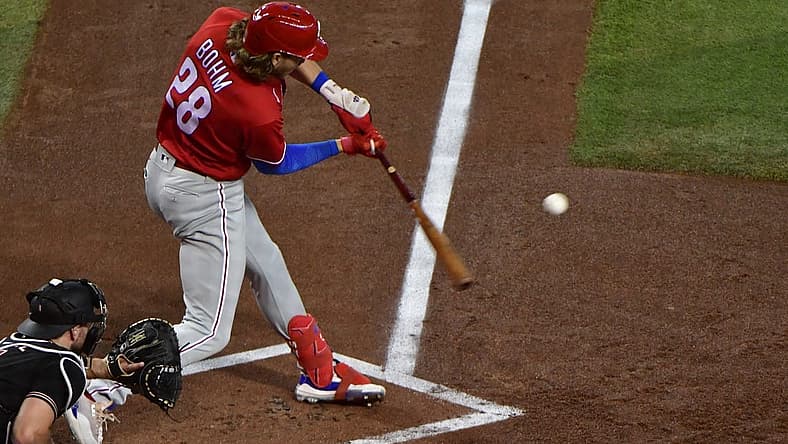 Aug 31, 2022; Phoenix, Arizona, USA;  Philadelphia Phillies third baseman Alec Bohm (28) hits an RBI single in the first inning against the Arizona Diamondbacks at Chase Field. Mandatory Credit: Matt Kartozian-USA TODAY Sports