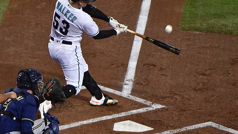 Sep 1, 2022; Phoenix, Arizona, USA; Arizona Diamondbacks first baseman Christian Walker (53) hits a two run home run in the first inning against the Milwaukee Brewers at Chase Field. Mandatory Credit: Matt Kartozian-USA TODAY Sports