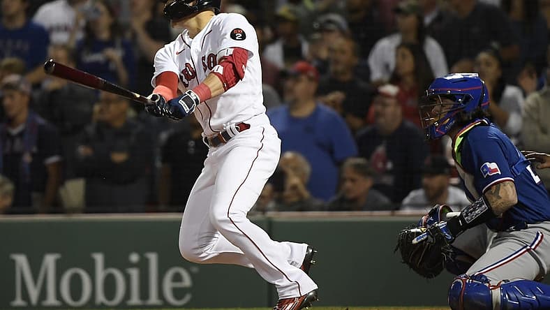 Sep 1, 2022; Boston, Massachusetts, USA; Boston Red Sox second baseman Enrique Hernandez (5) hits a Rbi single during the ninth inning against the Texas Rangers at Fenway Park. Mandatory Credit: Bob DeChiara-USA TODAY Sports