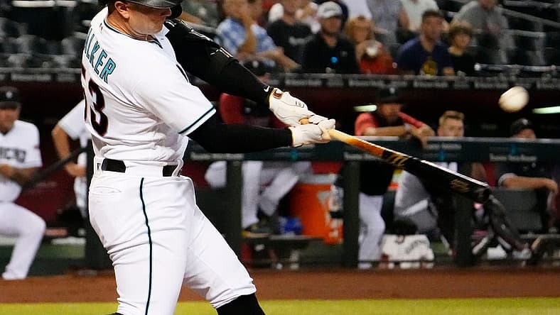Sep 1, 2022; Phoenix, Arizona, USA; Arizona Diamondbacks first baseman Christian Walker (53) hits a 2-run home run off Milwaukee Brewers starting pitcher Brandon Woodruff (53) in the first inning at Chase Field. Mandatory Credit: Rob Schumacher-Arizona Republic
Mlb Brewers At Diamondbacks