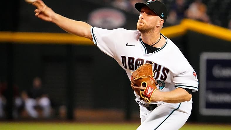 Sep 1, 2022; Phoenix, Arizona, USA; Arizona Diamondbacks starting pitcher Merrill Kelly (29) throws to the Milwaukee Brewers in the first inning at Chase Field. Mandatory Credit: Rob Schumacher-Arizona Republic
Mlb Brewers At Diamondbacks