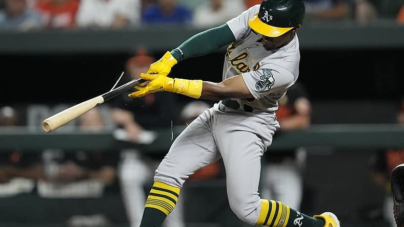 Sep 2, 2022; Baltimore, Maryland, USA; Oakland Athletics left fielder Tony Kemp (5) breaks his bat while hitting a two run RBI single against the Baltimore Orioles during the fifth inning at Oriole Park at Camden Yards. Mandatory Credit: Brent Skeen-USA TODAY Sports