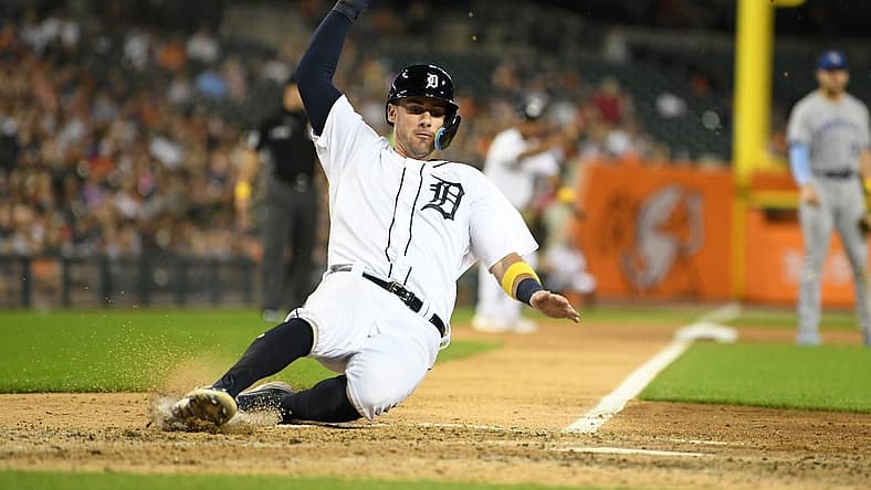 Sep 2, 2022; Detroit, Michigan, USA; Detroit Tigers third baseman Ryan Kreidler (32) slides safely into home on a sacrifice fly by right fielder Victor Reyes (22) (not pictured) against the Kansas City Royals in the fifth inning at Comerica Park. Mandatory Credit: Lon Horwedel-USA TODAY Sports