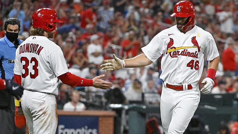 Sep 2, 2022; St. Louis, Missouri, USA; St. Louis Cardinals first baseman Paul Goldschmidt (46) and designated hitter Brendan Donovan (33) celebrate after they both scored against the Chicago Cubs during the first inning at Busch Stadium. Mandatory Credit: Jeff Curry-USA TODAY Sports