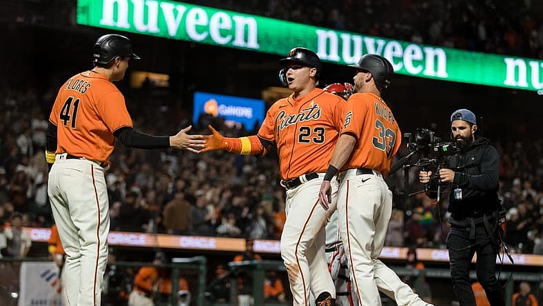 Sep 2, 2022; San Francisco, California, USA; San Francisco Giants left fielder Joc Pederson (23) celebrates with catcher Andrew Knapp (33) and designated hitter Wilmer Flores (41) after hitting a three-run home run against the Philadelphia Phillies during the second inning at Oracle Park. Mandatory Credit: John Hefti-USA TODAY Sports