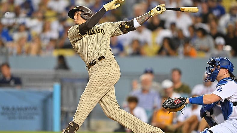 Sep 2, 2022; Los Angeles, California, USA; San Diego Padres third baseman Manny Machado (13) watches the flight of the ball a two run home run off Los Angeles Dodgers starting pitcher Dustin May (85) in the third inning at Dodger Stadium. Mandatory Credit: Jayne Kamin-Oncea-USA TODAY Sports