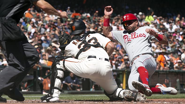 Sep 3, 2022; San Francisco, California, USA; San Francisco Giants catcher Andrew Knapp prepares to put the tag on Philadelphia Phillies left fielder Kyle Schwarber (12) as he attempts to score from third on a ground ball by Alex Bohm during the fifth inning at Oracle Park. Umpire is Chris Segal. Mandatory Credit: D. Ross Cameron-USA TODAY Sports