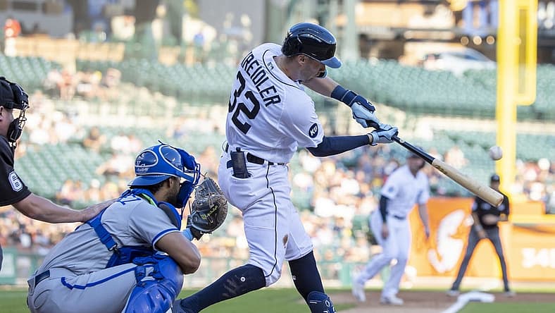 Sep 3, 2022; Detroit, Michigan, USA; Detroit Tigers shortstop Ryan Kreidler (32) hits a sacrifice fly for an RBI against the Kansas City Royals in the second inning at Comerica Park. Mandatory Credit: David Reginek-USA TODAY Sports