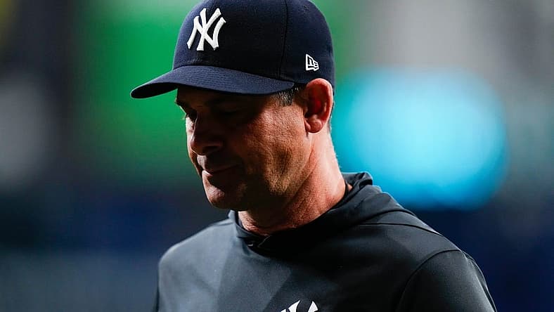 Sep 3, 2022; St. Petersburg, Florida, USA; New York Yankees manager Aaron Boone (17) walks off the field after talking to his players against the Tampa Bay Rays during the fifth inning at Tropicana Field. Mandatory Credit: Rich Storry-USA TODAY Sports