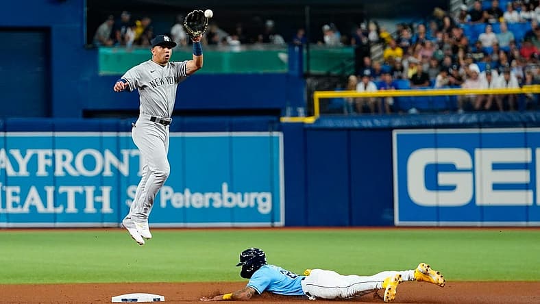 Sep 3, 2022; St. Petersburg, Florida, USA; New York Yankees shortstop Oswald Peraza (91) catches a throw as Tampa Bay Rays center fielder Jose Siri (22) slides in to second during the fifth inning at Tropicana Field. Mandatory Credit: Rich Storry-USA TODAY Sports