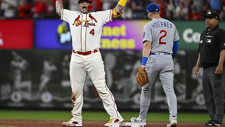 Sep 3, 2022; St. Louis, Missouri, USA; St. Louis Cardinals catcher Yadier Molina (4) reacts after hitting a three run double against the Chicago Cubs during the third inning at Busch Stadium. Mandatory Credit: Jeff Curry-USA TODAY Sports