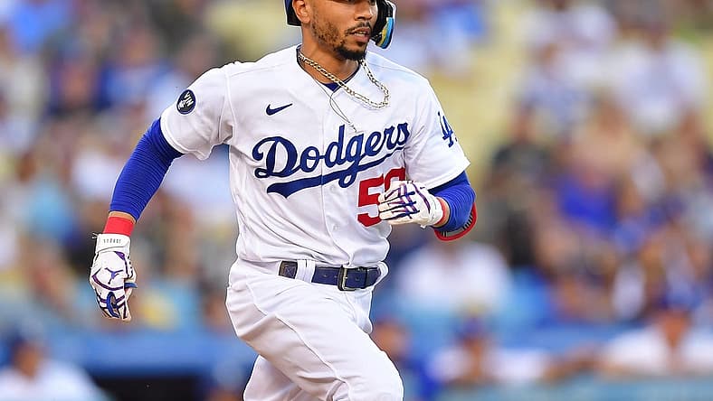 Sep 3, 2022; Los Angeles, California, USA; Los Angeles Dodgers second baseman Mookie Betts (50) runs after hitting a triple against the San Diego Padres during the first inning at Dodger Stadium. Mandatory Credit: Gary A. Vasquez-USA TODAY Sports