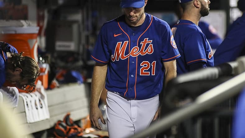 Sep 3, 2022; New York City, New York, USA; New York Mets starting pitcher Max Scherzer (21) walks into the dugout after being taken out of the game against the Washington Nationals in the fifth inning at Citi Field. Mandatory Credit: Wendell Cruz-USA TODAY Sports