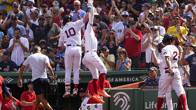 Sep 4, 2022; Boston, Massachusetts, USA; Boston Red Sox center fielder Enrique Hernandez (5) hi fives second baseman Trevor Story (10) for hitting a three-run home run against the Texas Rangers during the first inning at Fenway Park. Mandatory Credit: Gregory Fisher-USA TODAY Sports