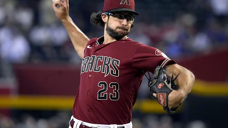 Sep 4, 2022; Phoenix, Arizona, USA; Arizona Diamondbacks starting pitcher Zac Gallen (23) throws against the Milwaukee Brewers in the first inning at Chase Field. Mandatory Credit: Rick Scuteri-USA TODAY Sports