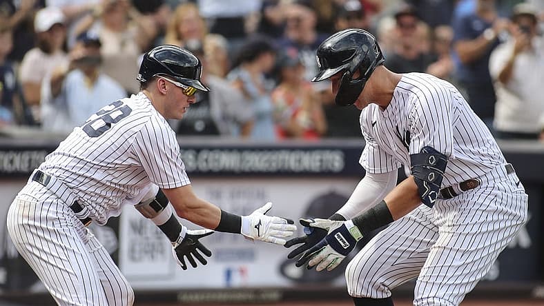 Sep 5, 2022; Bronx, New York, USA; New York Yankees center fielder Aaron Judge (99) is greeted by New York Yankees third baseman Josh Donaldson (28) after hitting a two run home run in the sixth inning against the Minnesota Twins at Yankee Stadium. Mandatory Credit: Wendell Cruz-USA TODAY Sports