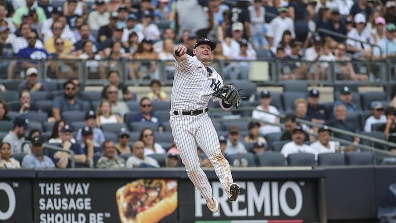 Sep 5, 2022; Bronx, New York, USA; New York Yankees third baseman Josh Donaldson (28) makes a leaping throw to complete an inning ending double play in the seventh inning against the Minnesota Twins at Yankee Stadium. Mandatory Credit: Wendell Cruz-USA TODAY Sports