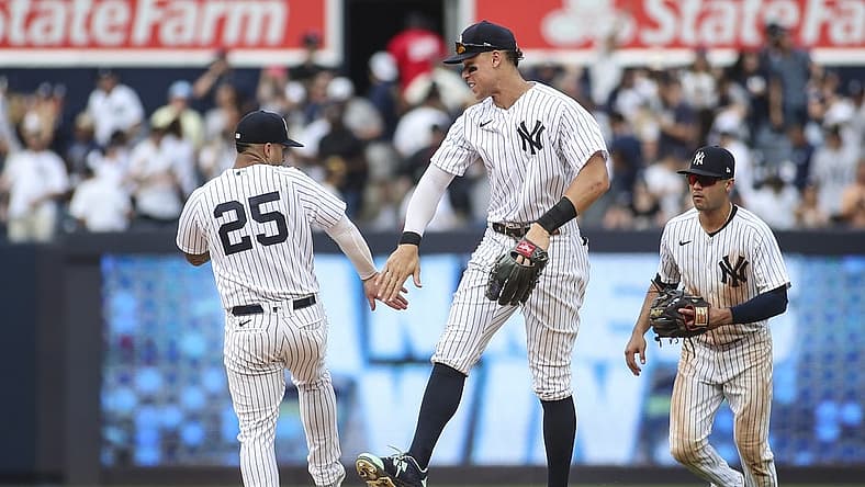 Sep 5, 2022; Bronx, New York, USA; New York Yankees second baseman Gleyber Torres (25) and right fielder Aaron Judge (99) celebrate after defeating the Minnesota Twins 5-2 at Yankee Stadium. Mandatory Credit: Wendell Cruz-USA TODAY Sports