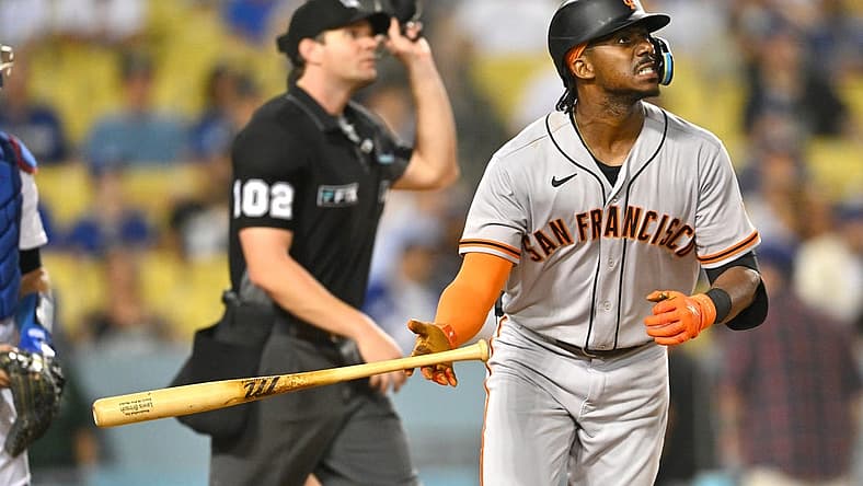 Sep 5, 2022; Los Angeles, California, USA; San Francisco Giants center fielder Lewis Brinson (29) hits his second home run of the game, a solo shot in the ninth inning, against the Los Angeles Dodgers at Dodger Stadium. Mandatory Credit: Jayne Kamin-Oncea-USA TODAY Sports
