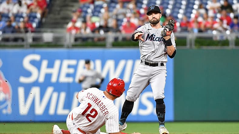 Sep 6, 2022; Philadelphia, Pennsylvania, USA; Philadelphia Phillies left fielder Kyle Schwarber (12) is forced out at second base by Miami Marlins third baseman Jon Berti (5) during the third inning at Citizens Bank Park. Mandatory Credit: Eric Hartline-USA TODAY Sports