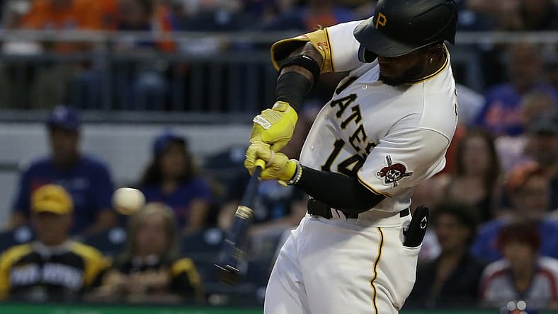 Sep 6, 2022; Pittsburgh, Pennsylvania, USA; Pittsburgh Pirates designated hitter Rodolfo Castro (14) hits a two run home run against the New York Mets during the third inning at PNC Park. Mandatory Credit: Charles LeClaire-USA TODAY Sports