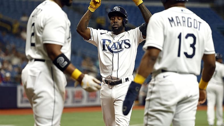 Sep 6, 2022; St. Petersburg, Florida, USA;Tampa Bay Rays left fielder Randy Arozarena (56) is congratulated by  third baseman Yandy Diaz (2) and right fielder Manuel Margot (13) after he hit a three-run home run against the Boston Red Sox during the first inning at Tropicana Field. Mandatory Credit: Kim Klement-USA TODAY Sports