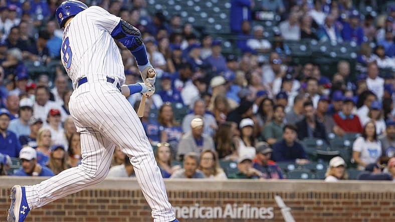 Sep 6, 2022; Chicago, Illinois, USA; Chicago Cubs left fielder Ian Happ (8) hits a solo home run against the Cincinnati Reds during the first inning at Wrigley Field. Mandatory Credit: Kamil Krzaczynski-USA TODAY Sports
