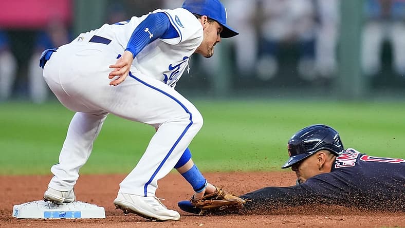 Sep 6, 2022; Kansas City, Missouri, USA; Cleveland Guardians second baseman Andres Gimenez (0) is caught stealing second base by Kansas City Royals second baseman Michael Massey (19) during the first inning at Kauffman Stadium. Mandatory Credit: Jay Biggerstaff-USA TODAY Sports