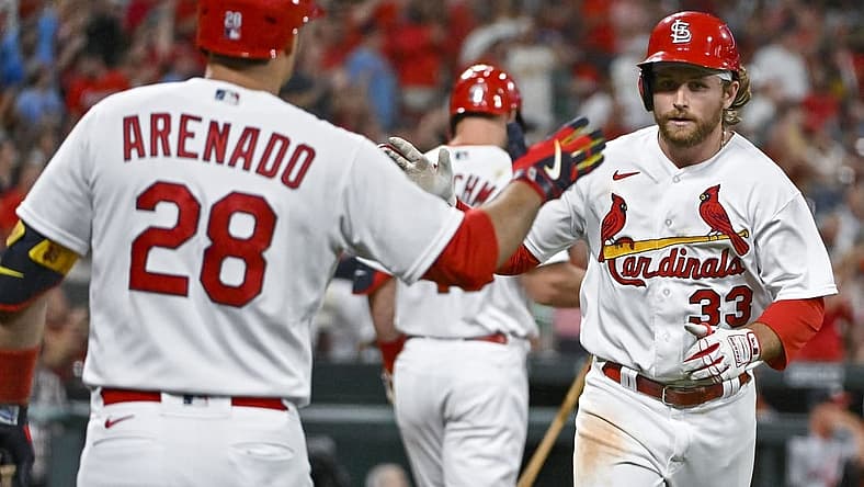Sep 6, 2022; St. Louis, Missouri, USA; St. Louis Cardinals third baseman Brendan Donovan (33) is congratulated by designated hitter Nolan Arenado (28) after hitting a solo home run against the Washington Nationals during the fourth inning at Busch Stadium. Mandatory Credit: Jeff Curry-USA TODAY Sports