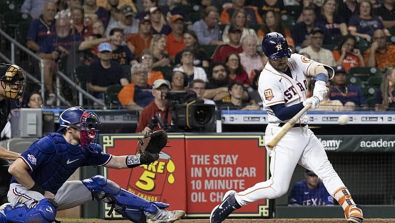 Sep 6, 2022; Houston, Texas, USA; Houston Astros third baseman Alex Bregman (2) hits a single against the Texas Rangers in the fifth inning at Minute Maid Park. Mandatory Credit: Thomas Shea-USA TODAY Sports