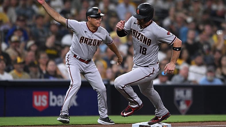 Sep 6, 2022; San Diego, California, USA; Arizona Diamondbacks catcher Carson Kelly (18) is waved home by third base coach Tony Perezchica (left) on a double hit by shortstop Sergio Alcantara (not pictured) during the fourth inning against the San Diego Padres at Petco Park. Mandatory Credit: Orlando Ramirez-USA TODAY Sports