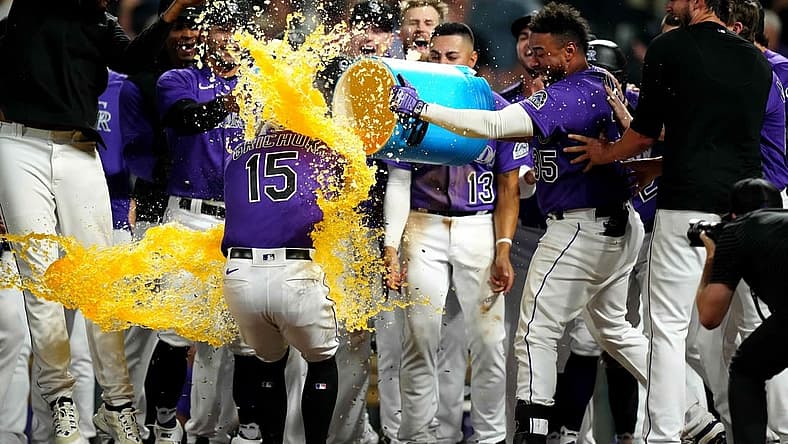 Sep 6, 2022; Denver, Colorado, USA; Colorado Rockies center fielder Randal Grichuk (15) celebrates his walk-off three-run home run in the eleventh inning against the Milwaukee Brewers at Coors Field. Mandatory Credit: Ron Chenoy-USA TODAY Sports
