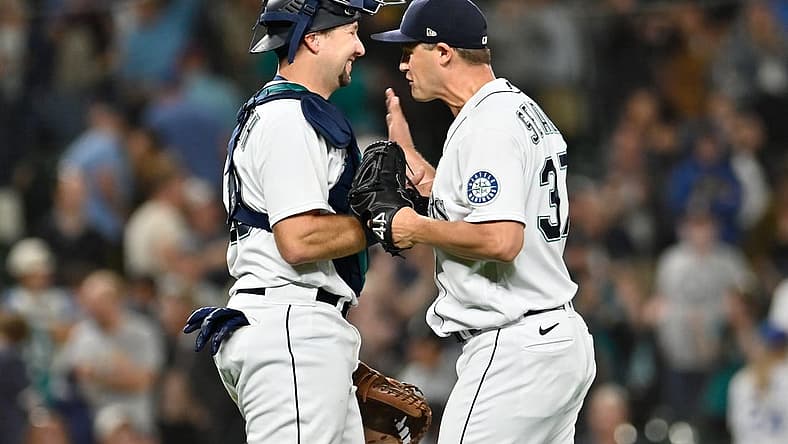 Sep 6, 2022; Seattle, Washington, USA; Seattle Mariners catcher Cal Raleigh (29) and Seattle Mariners relief pitcher Paul Sewald (37) celebrate defeating the Chicago White Sox at T-Mobile Park. Seattle defeated Chicago 3-0. Mandatory Credit: Steven Bisig-USA TODAY Sports