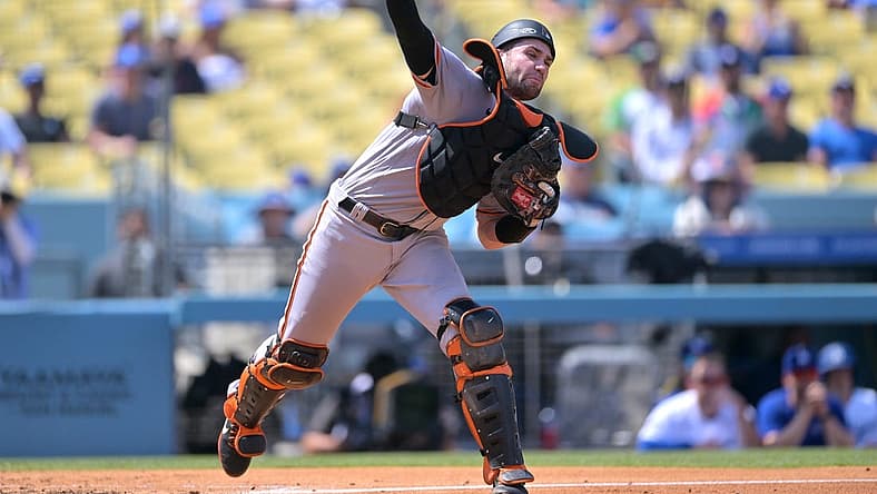Sep 7, 2022; Los Angeles, California, USA;  San Francisco Giants catcher Austin Wynns (14) throws to first for a double play in the third inning against the Los Angeles Dodgers at Dodger Stadium. Mandatory Credit: Jayne Kamin-Oncea-USA TODAY Sports