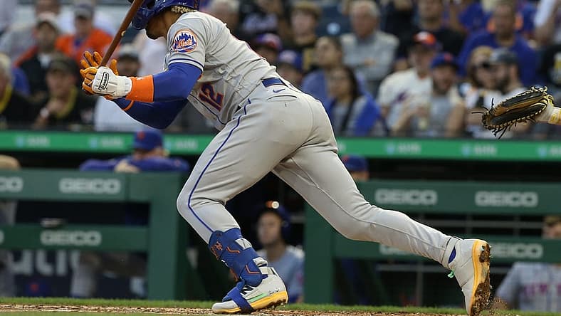 Sep 7, 2022; Pittsburgh, Pennsylvania, USA; New York Mets shortstop Francisco Lindor (12) hits a two run double down the right field line against the Pittsburgh Pirates during the second inning at PNC Park. Mandatory Credit: Charles LeClaire-USA TODAY Sports