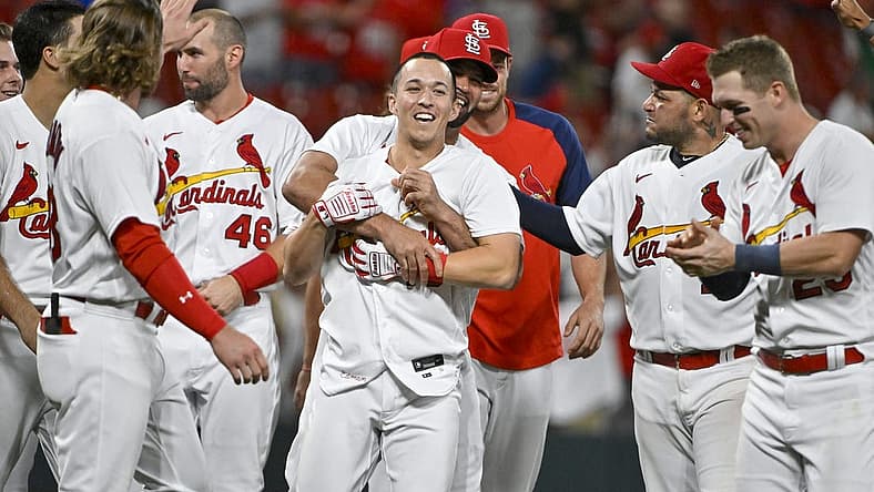 Sep 7, 2022; St. Louis, Missouri, USA; St. Louis Cardinals shortstop Tommy Edman (19) celebrates with Albert Pujols (5) and teammates after hitting a walk-off two run double against the Washington Nationals during the ninth inning at Busch Stadium. Mandatory Credit: Jeff Curry-USA TODAY Sports