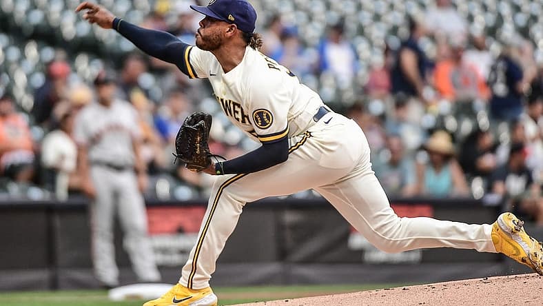 Sep 8, 2022; Milwaukee, Wisconsin, USA; Milwaukee Brewers starting pitcher Freddy Peralta (51) throws a pitch in the first inning against the San Francisco Giants at American Family Field. Mandatory Credit: Benny Sieu-USA TODAY Sports