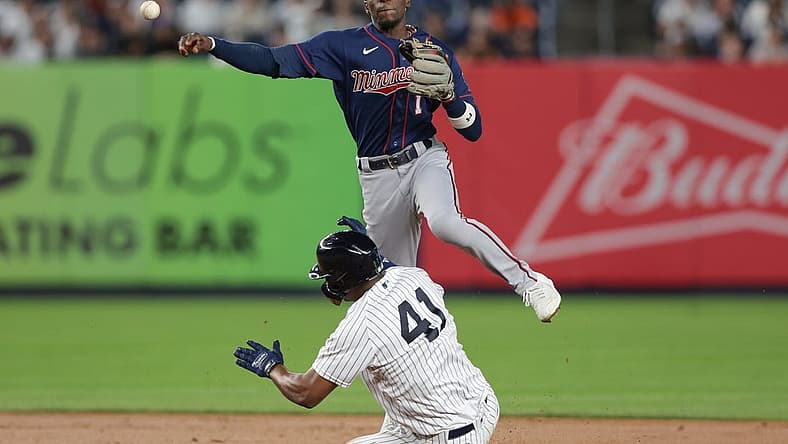 Sep 8, 2022; Bronx, New York, USA; Minnesota Twins left fielder Nick Gordon (1) throws to first base to complete a double play as New York Yankees designated hitter Miguel Andujar (41) slides during the fourth inning at Yankee Stadium. Mandatory Credit: Vincent Carchietta-USA TODAY Sports