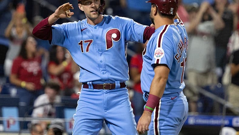 Sep 8, 2022; Philadelphia, Pennsylvania, USA; Philadelphia Phillies first baseman Rhys Hoskins (17) and left fielder Kyle Schwarber (12) celebrate after scoring against the Miami Marlins during the fifth inning at Citizens Bank Park. Mandatory Credit: Bill Streicher-USA TODAY Sports