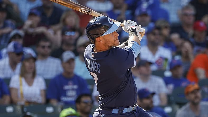 Sep 9, 2022; Chicago, Illinois, USA; Chicago Cubs catcher Yan Gomes (7) hits a two-run home run against the San Francisco Giants during the second inning at Wrigley Field. Mandatory Credit: Kamil Krzaczynski-USA TODAY Sports