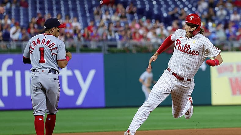 Sep 9, 2022; Philadelphia, Pennsylvania, USA; Philadelphia Phillies third baseman Alec Bohm (28) runs the bases past Washington Nationals second baseman Cesar Hernandez (1) on his way to scoring a run during the fourth inning at Citizens Bank Park. Mandatory Credit: Bill Streicher-USA TODAY Sports
