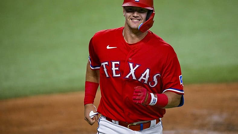 Sep 9, 2022; Arlington, Texas, USA; Texas Rangers third baseman Josh Jung (6) smiles as he comes home after he hits a home run in his first major league at bat during the third inning against the Toronto Blue Jays at the Globe Life Field. Mandatory Credit: Jerome Miron-USA TODAY Sports